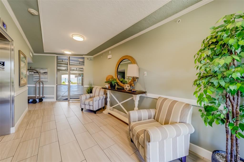 16550 Gulf Boulevard, Unit 643 North Redington Beach, FL 33708 - Photo 47 of 67 a living room with furniture and a potted plant