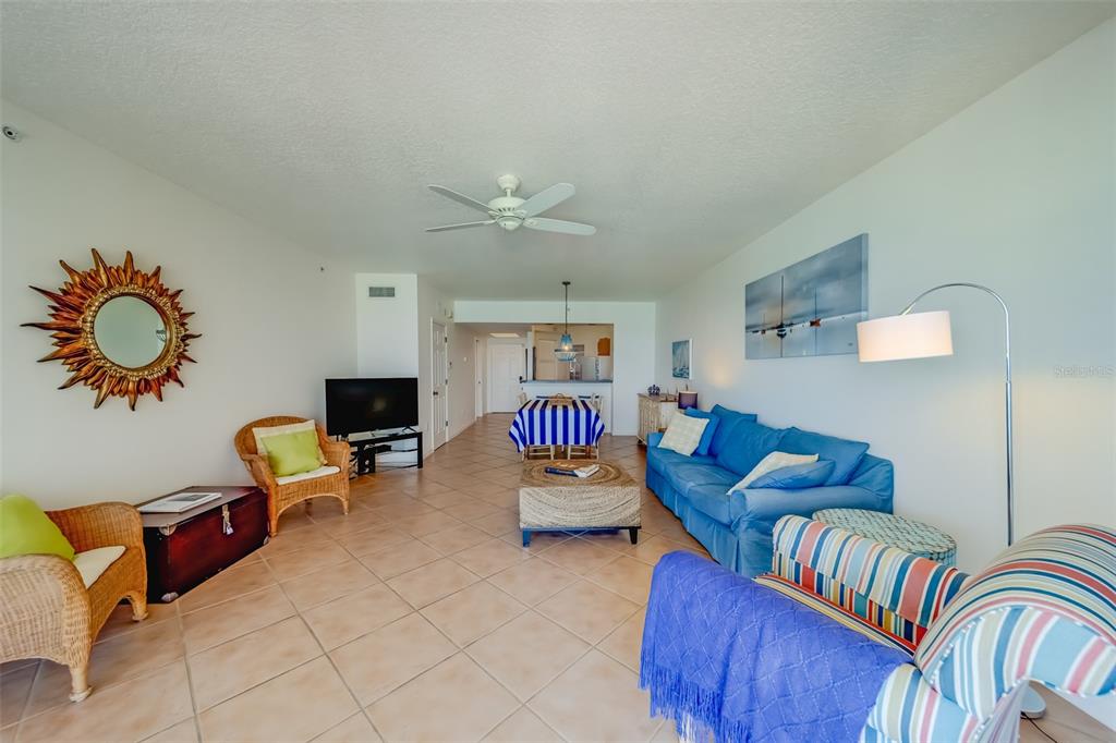 16550 Gulf Boulevard, Unit 643 North Redington Beach, FL 33708 - Photo 7 of 67 a bedroom with furniture and a chair