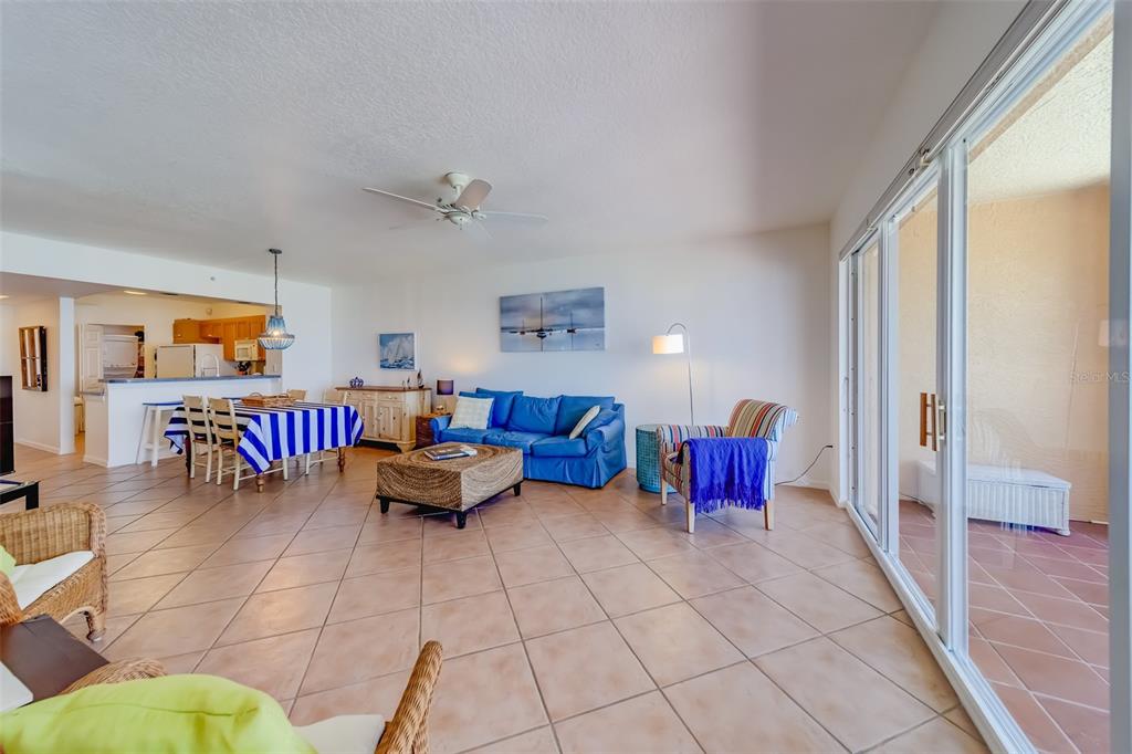 16550 Gulf Boulevard, Unit 643 North Redington Beach, FL 33708 - Photo 8 of 67 a living room with furniture a rug and a chandelier