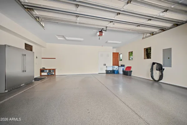 a living room with furniture a chandelier and a fireplace