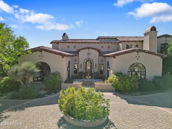 a living room with furniture a flat screen tv and a floor to ceiling window