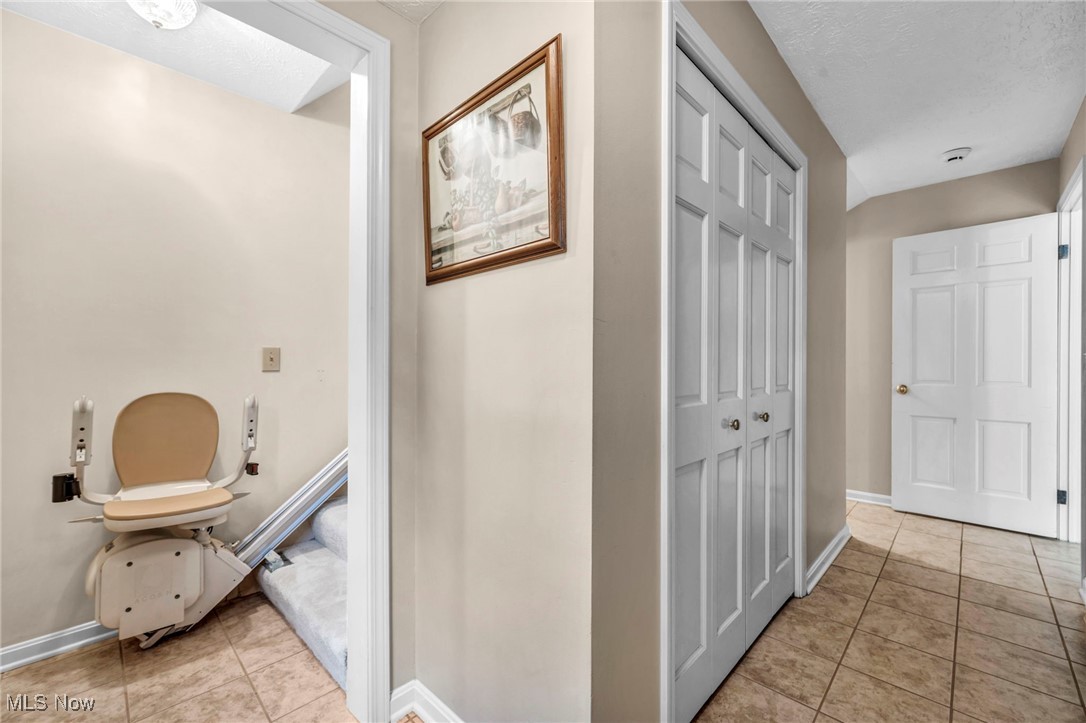 38814 Johnnycake Ridge Road Willoughby, OH 44094 - Photo 19 of 48 Stairlift to back staircase going up stairs