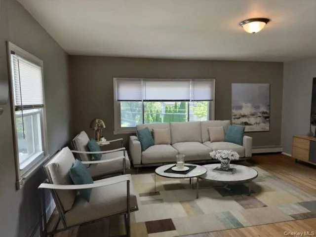 a living room with a couch and a window