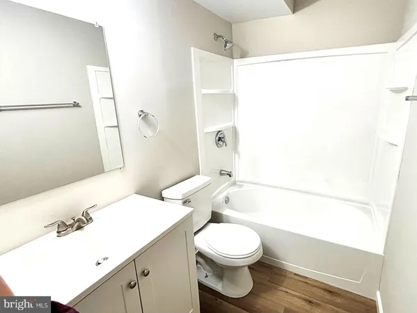 a bathroom with a toilet a sink and a bathtub