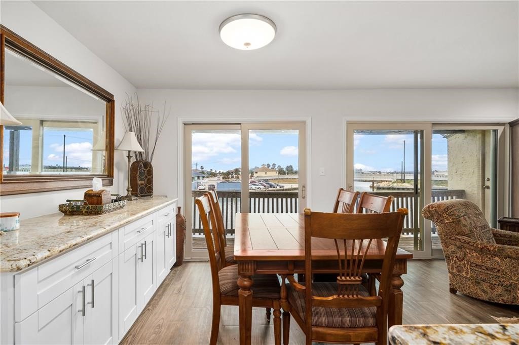 620 Fulton Beach Road, Unit 203 Rockport, TX 78382 - Photo 13 of 37 a view of a a dining room with furniture window and outside view