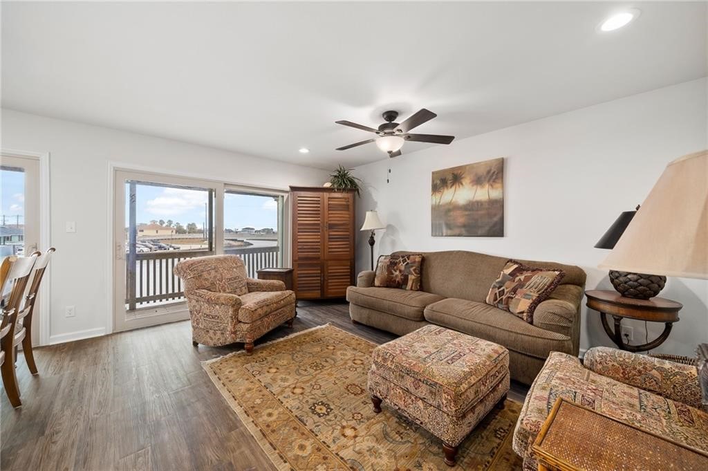 620 Fulton Beach Road, Unit 203 Rockport, TX 78382 - Photo 16 of 37 a living room with furniture and wooden floor