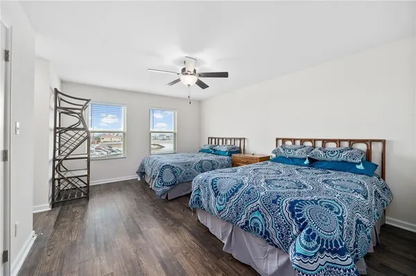 a bedroom with double bed and a window