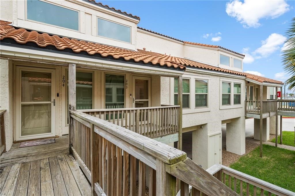 620 Fulton Beach Road, Unit 203 Rockport, TX 78382 - Photo 2 of 37 a front view of a house with balcony