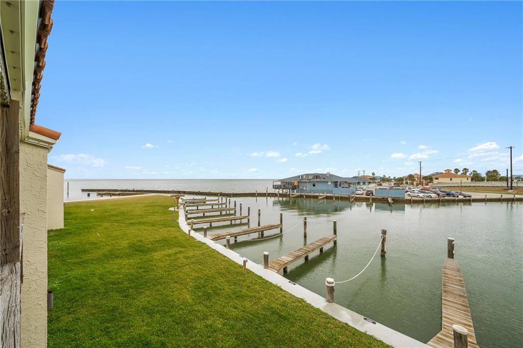 620 Fulton Beach Road, Unit 203 Rockport, TX 78382 - Photo 26 of 37 a view of a lake with a outdoor space