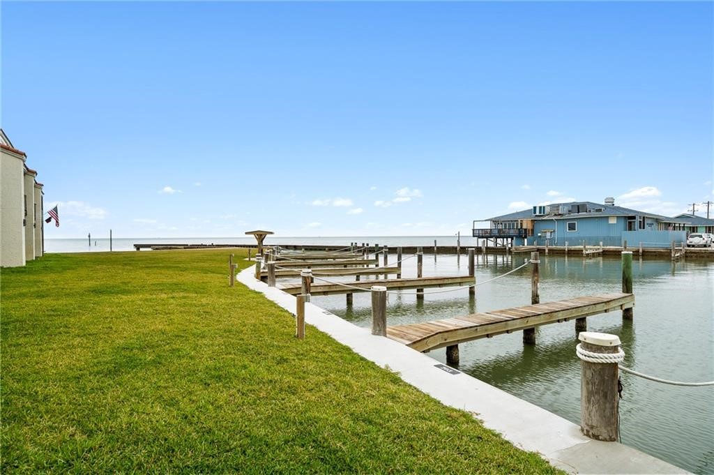 620 Fulton Beach Road, Unit 203 Rockport, TX 78382 - Photo 28 of 37 a view of a swimming pool with an ocean view