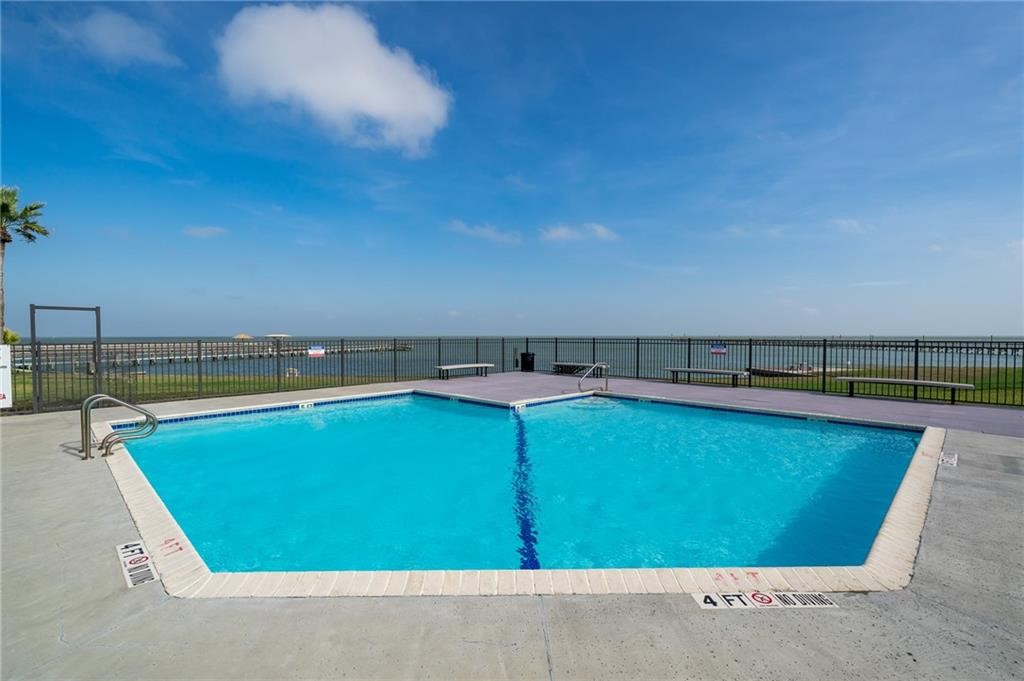 620 Fulton Beach Road, Unit 203 Rockport, TX 78382 - Photo 30 of 37 a view of a swimming pool and an outdoor seating