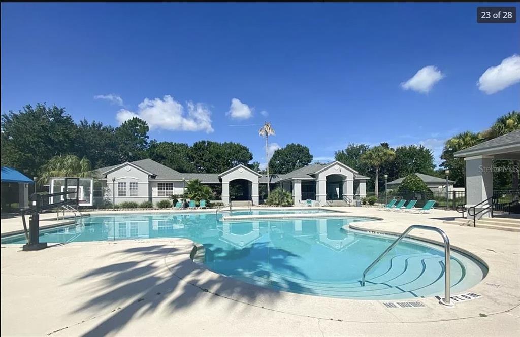 3705 Southwest 27th Street, Unit 713 Gainesville, FL 32608 - Photo 11 of 13 a front view of a house with garden