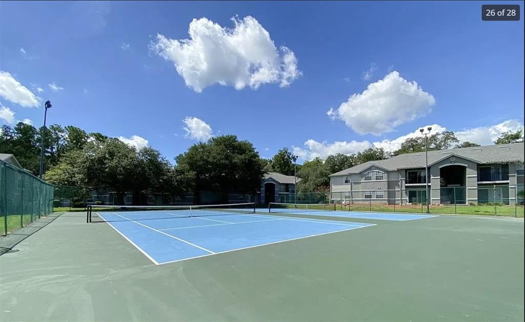 3705 Southwest 27th Street, Unit 713 Gainesville, FL 32608 - Photo 12 of 13 a view of a tennis court