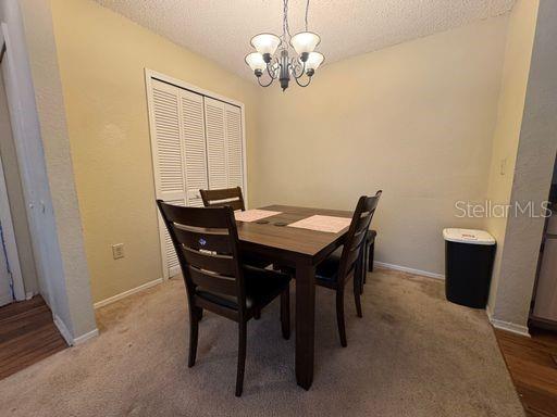 3705 Southwest 27th Street, Unit 713 Gainesville, FL 32608 - Photo 2 of 13 a view of a dining room with a table and chairs