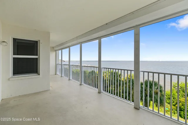 a view of an empty room with sliding door