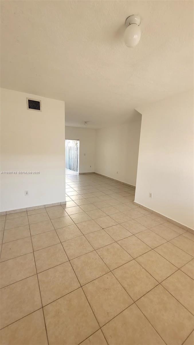 7241 Northwest 174th Terrace, Unit 103 Hialeah, FL 33015 - Photo 13 of 19 a view of an empty room