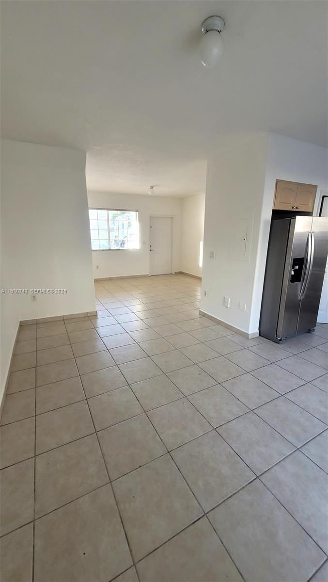 7241 Northwest 174th Terrace, Unit 103 Hialeah, FL 33015 - Photo 16 of 19 a view of a livingroom with wooden floor and a window