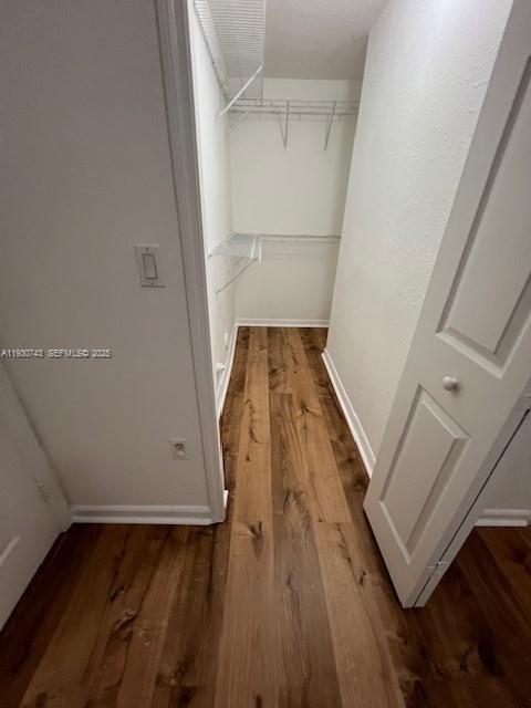7241 Northwest 174th Terrace, Unit 103 Hialeah, FL 33015 - Photo 4 of 19 wooden floor with staircase