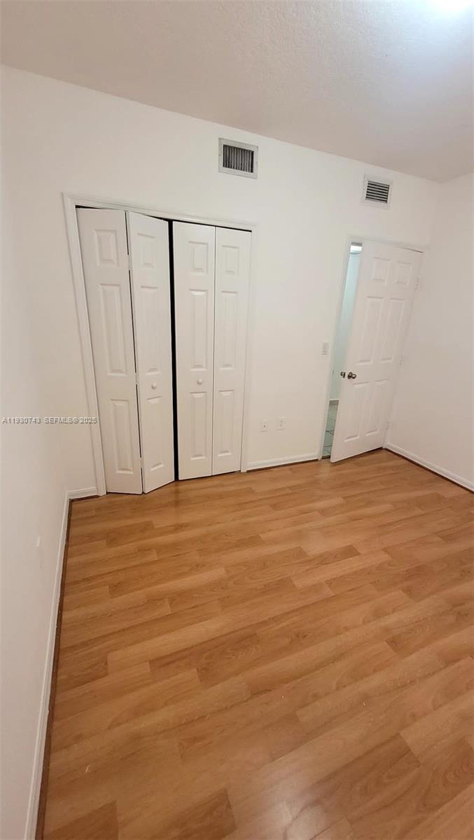 7241 Northwest 174th Terrace, Unit 103 Hialeah, FL 33015 - Photo 9 of 19 a view of an empty room