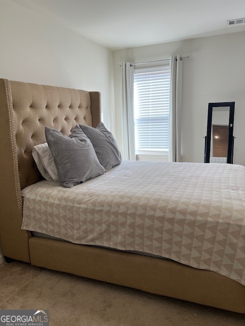 832 Ambient Way Atlanta, GA 30331 - Photo 21 of 32 a large bed sitting in a bedroom next to a window
