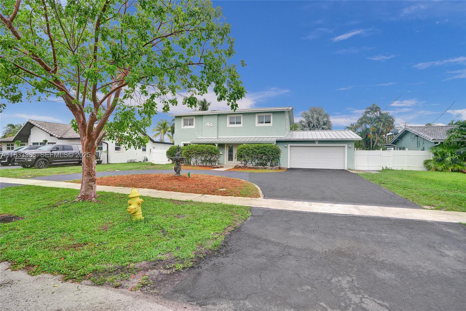 a view of a house with a yard