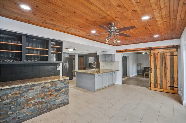a view of entryway with furniture and wooden floor