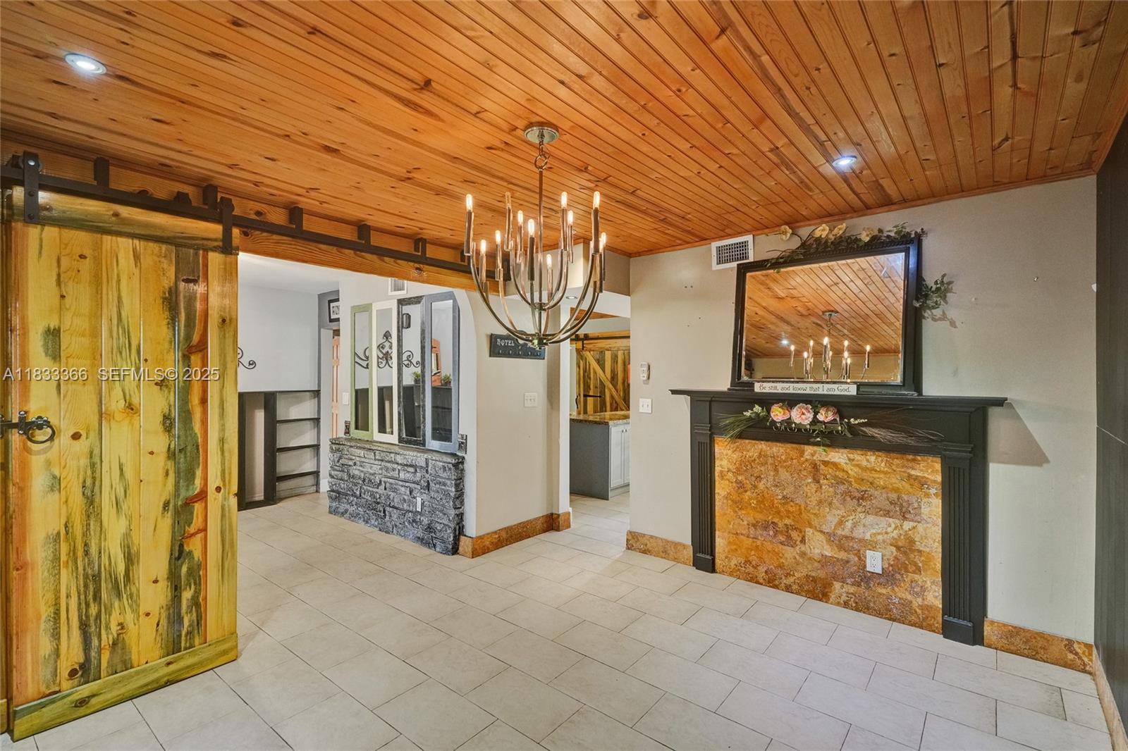 5840 Southwest 19th Street Plantation, FL 33317 - Photo 18 of 66 a view of an empty room with wooden floor and a door