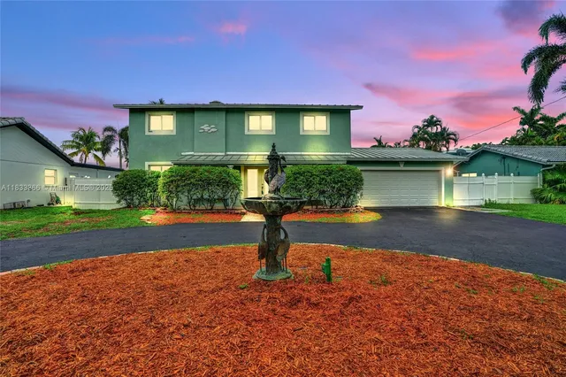 a view of a house with swimming pool yard and a patio