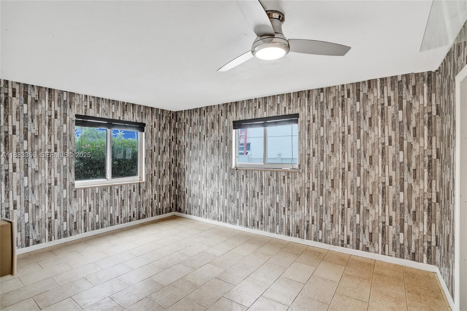 5840 Southwest 19th Street Plantation, FL 33317 - Photo 27 of 66 an empty room with windows