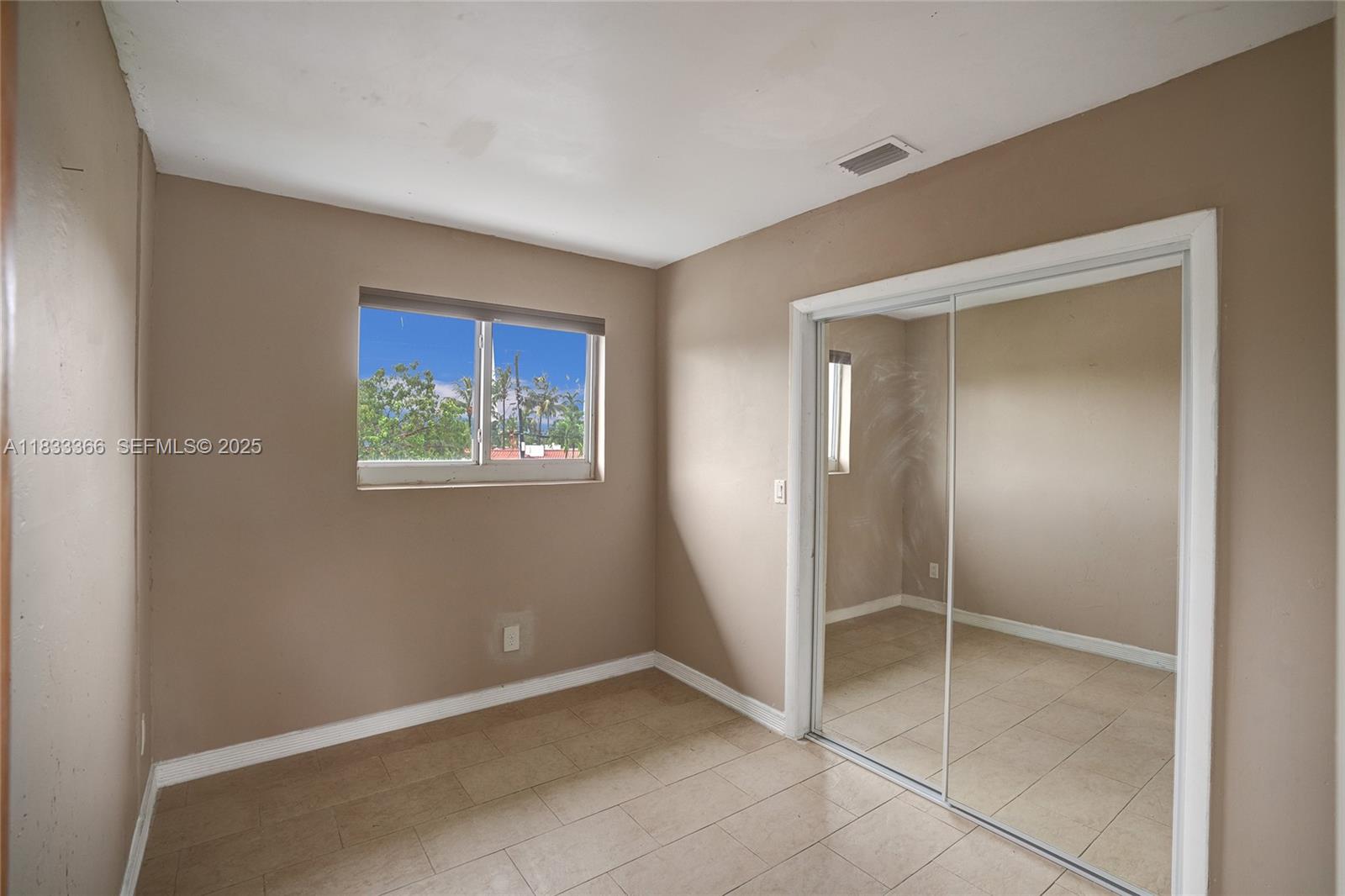5840 Southwest 19th Street Plantation, FL 33317 - Photo 37 of 66 a view of an empty room with closet and a bathroom