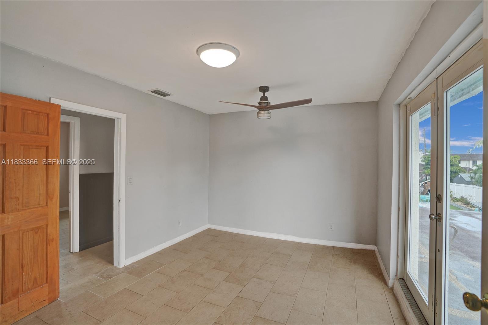 5840 Southwest 19th Street Plantation, FL 33317 - Photo 39 of 66 a view of an empty room with a window