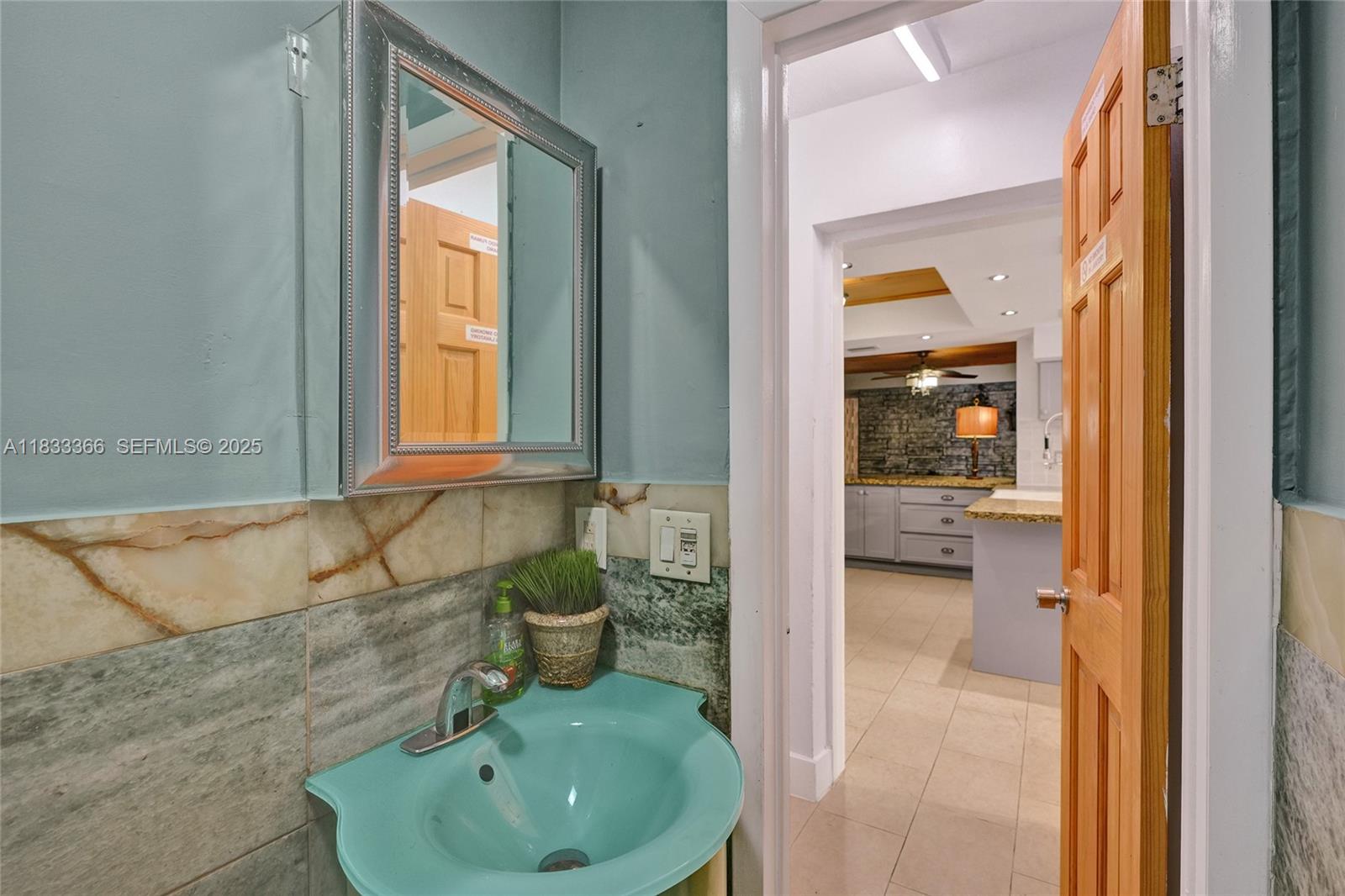 5840 Southwest 19th Street Plantation, FL 33317 - Photo 44 of 66 a bathroom with a sink and a tub