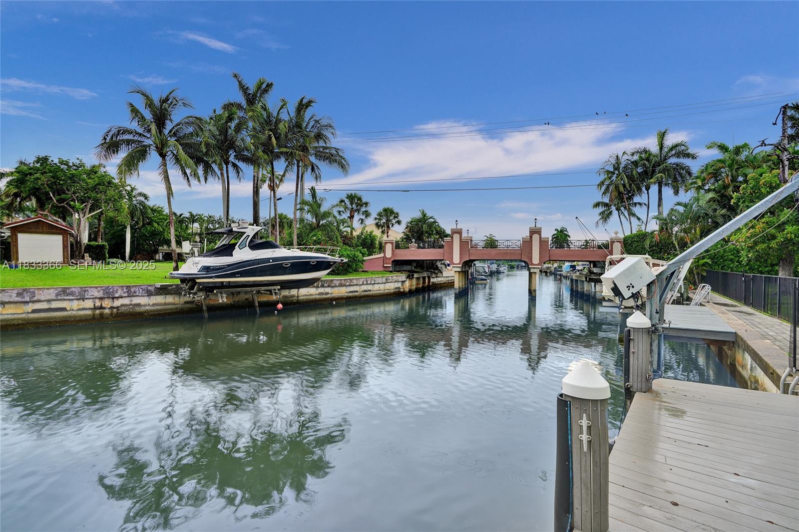 5840 Southwest 19th Street Plantation, FL 33317 - Photo 47 of 66 a view of a lake with a house in the background
