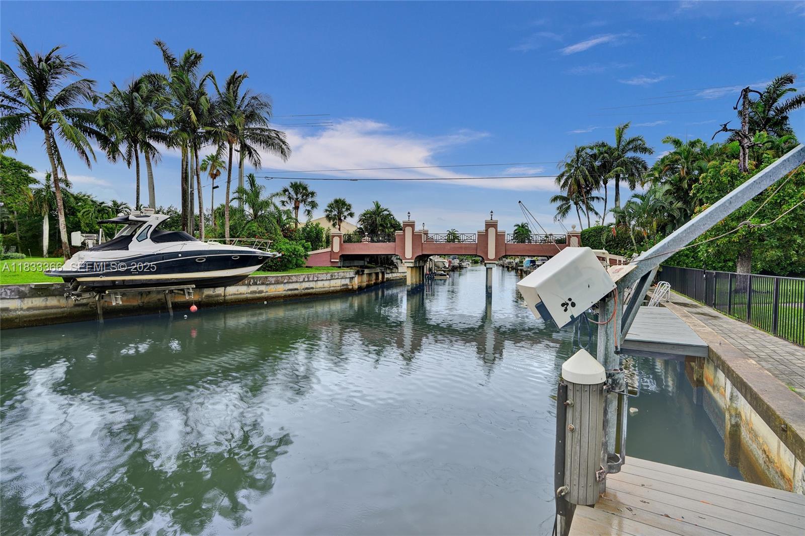 5840 Southwest 19th Street Plantation, FL 33317 - Photo 48 of 66 a view of a lake with boats and palm trees