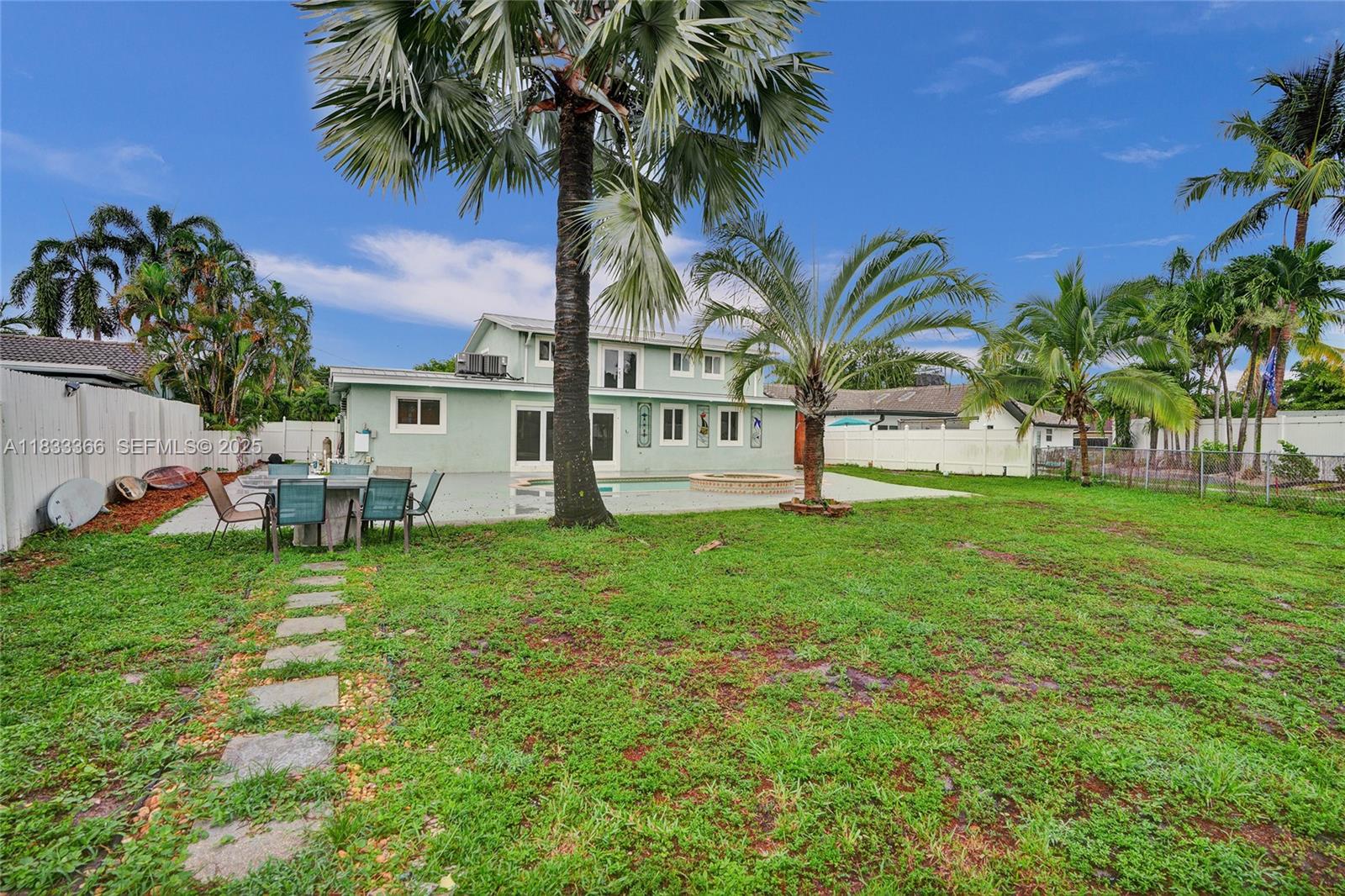 5840 Southwest 19th Street Plantation, FL 33317 - Photo 52 of 66 a view of backyard with outdoor seating ad green space