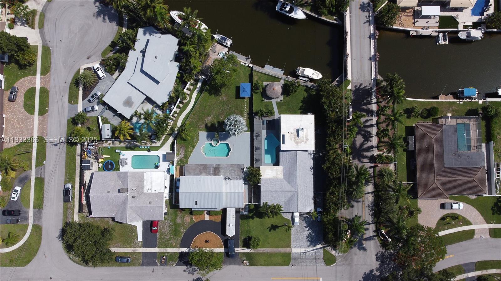 5840 Southwest 19th Street Plantation, FL 33317 - Photo 65 of 66 an aerial view of multiple houses with outdoor space