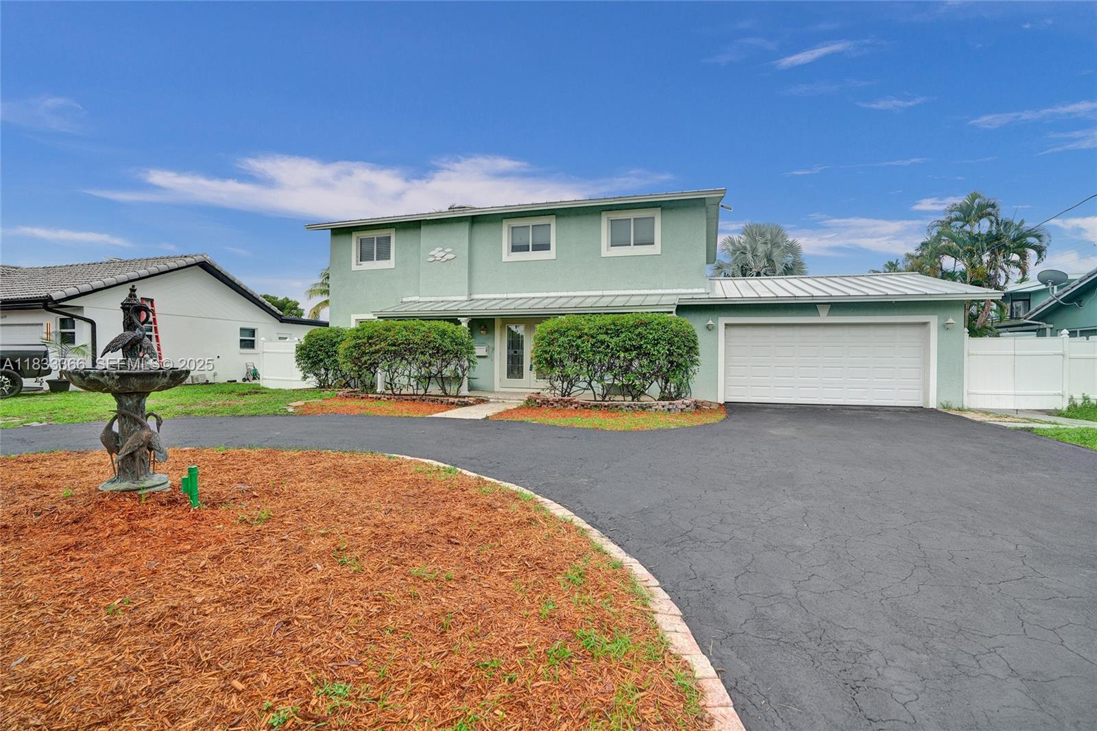 5840 Southwest 19th Street Plantation, FL 33317 - Photo 7 of 66 a view of house with outdoor space and swimming pool