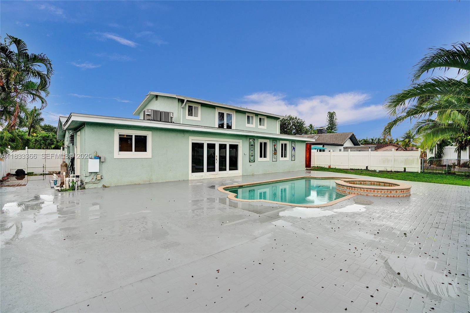 5840 Southwest 19th Street Plantation, FL 33317 - Photo 10 of 66 a view of a house with a swimming pool