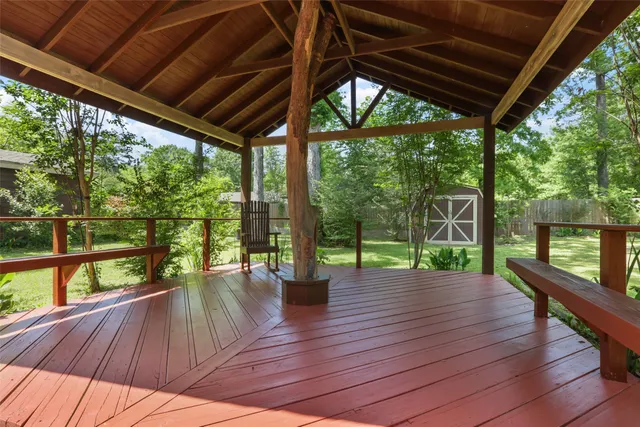a porch with wooden floors in outdoor space