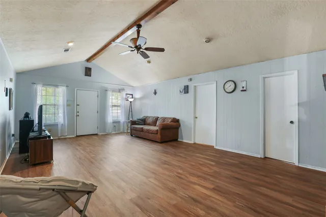 a view of a livingroom with furniture and wooden floor