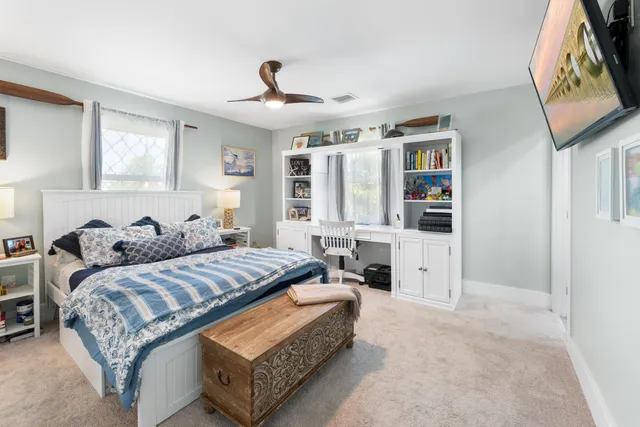 a bedroom with bed and window