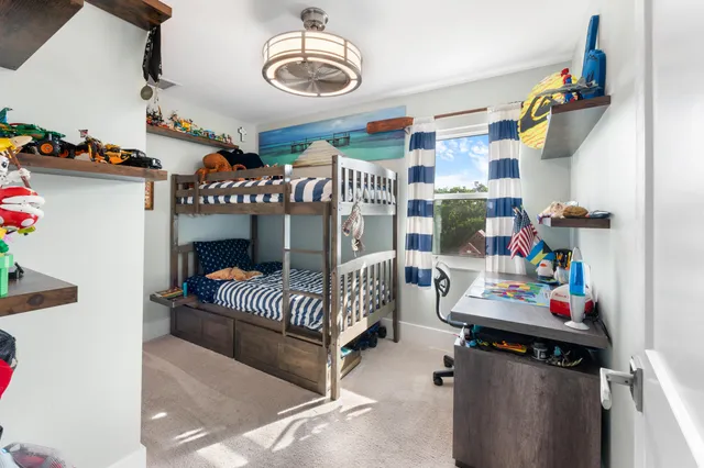 a bedroom with furniture and a chandelier