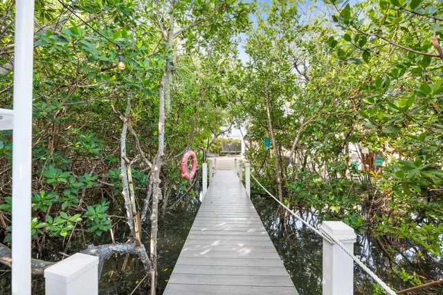 a view of a pathway with a garden
