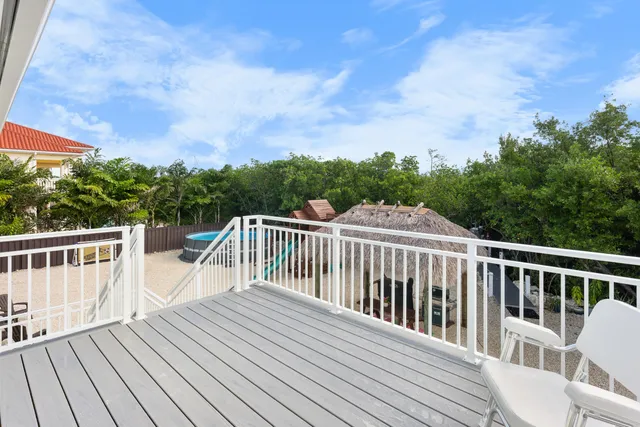 a view of a wooden deck and a yard