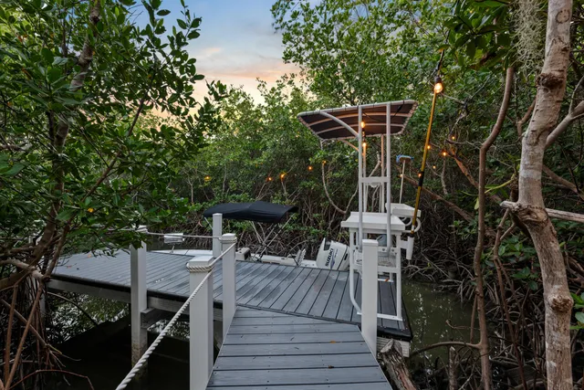 a view of outdoor sitting area with furniture and tree