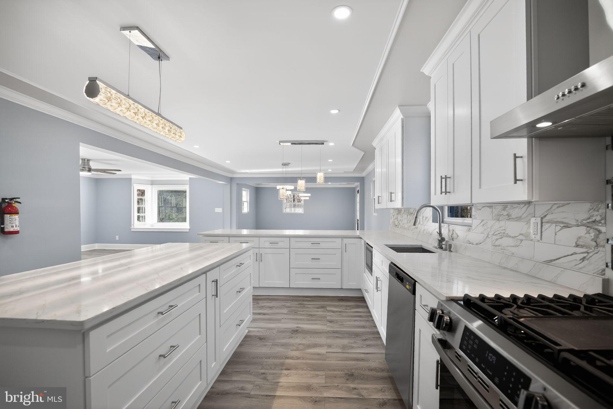 931 Woodlane Road Westampton, NJ 08060 - Photo 13 of 33 a large kitchen with granite countertop a stove and a sink