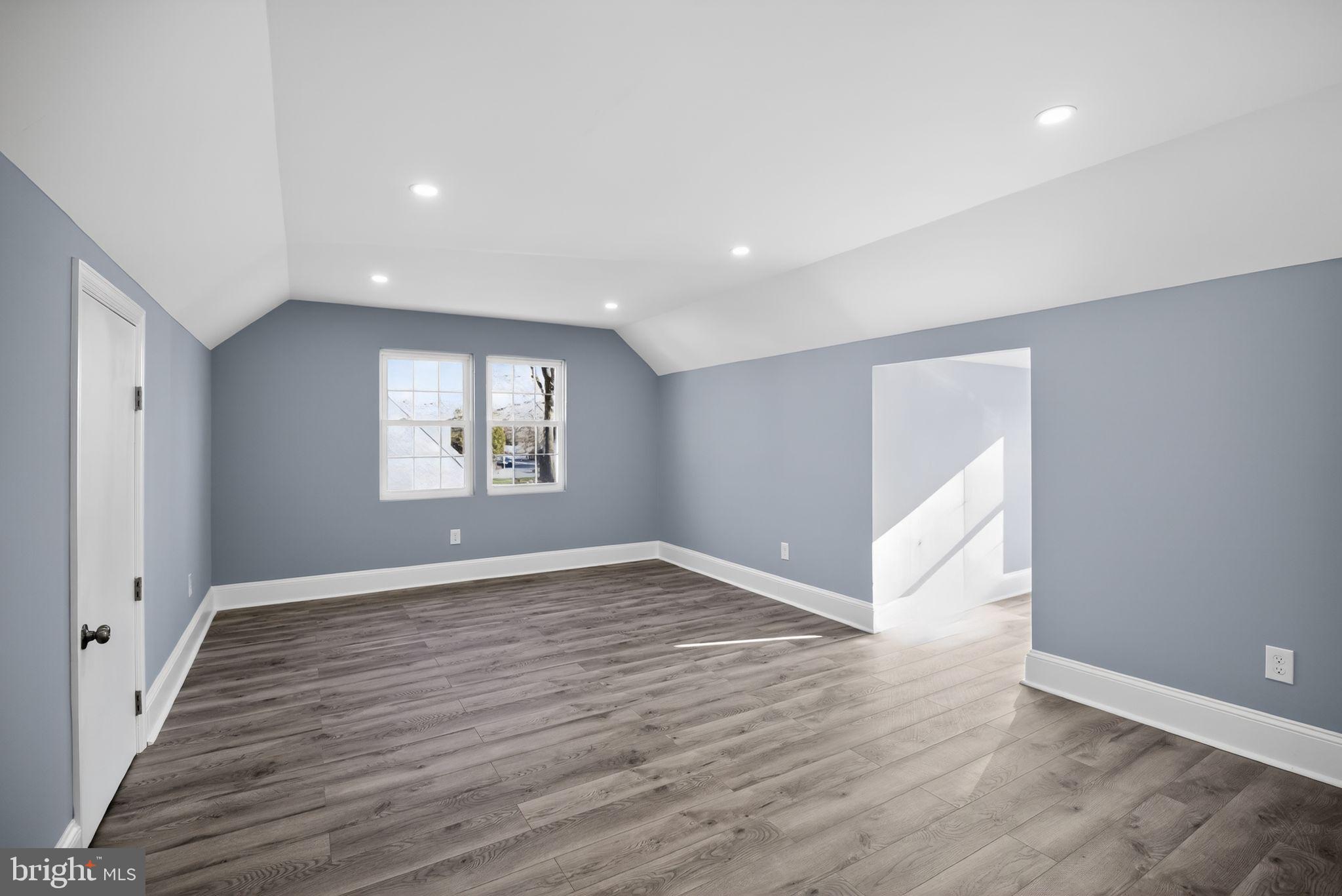 931 Woodlane Road Westampton, NJ 08060 - Photo 29 of 33 an empty room with wooden floor and windows