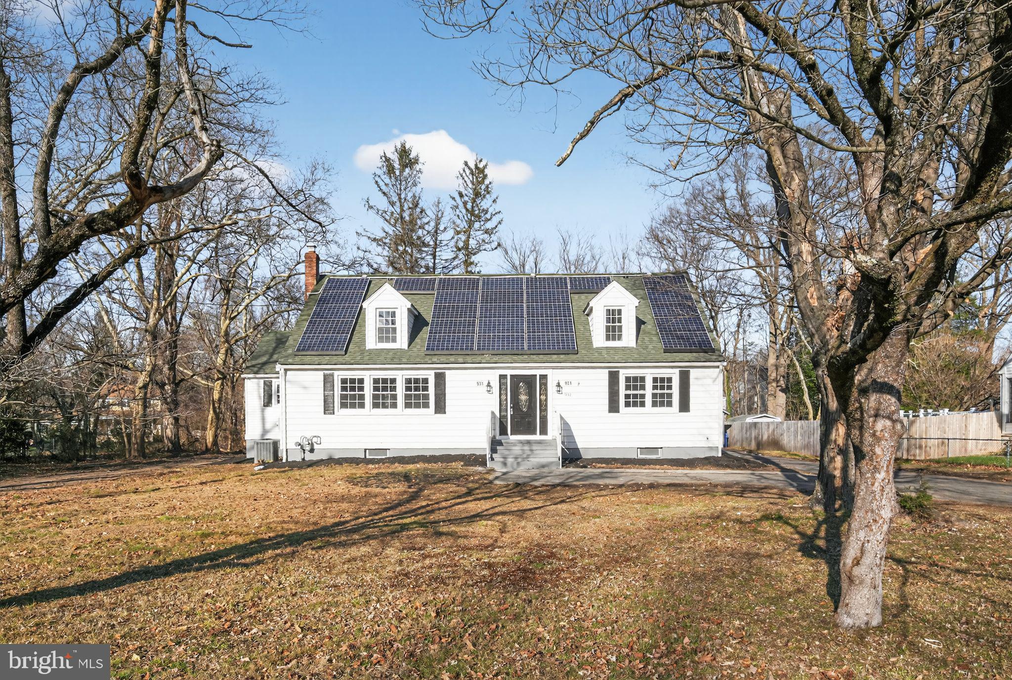 931 Woodlane Road Westampton, NJ 08060 - Photo 6 of 33 a front view of a house with a yard and garage