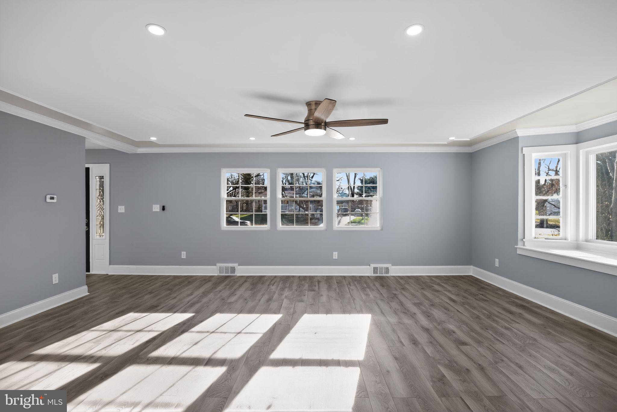 931 Woodlane Road Westampton, NJ 08060 - Photo 7 of 33 a view of an empty room with a window and wooden floor