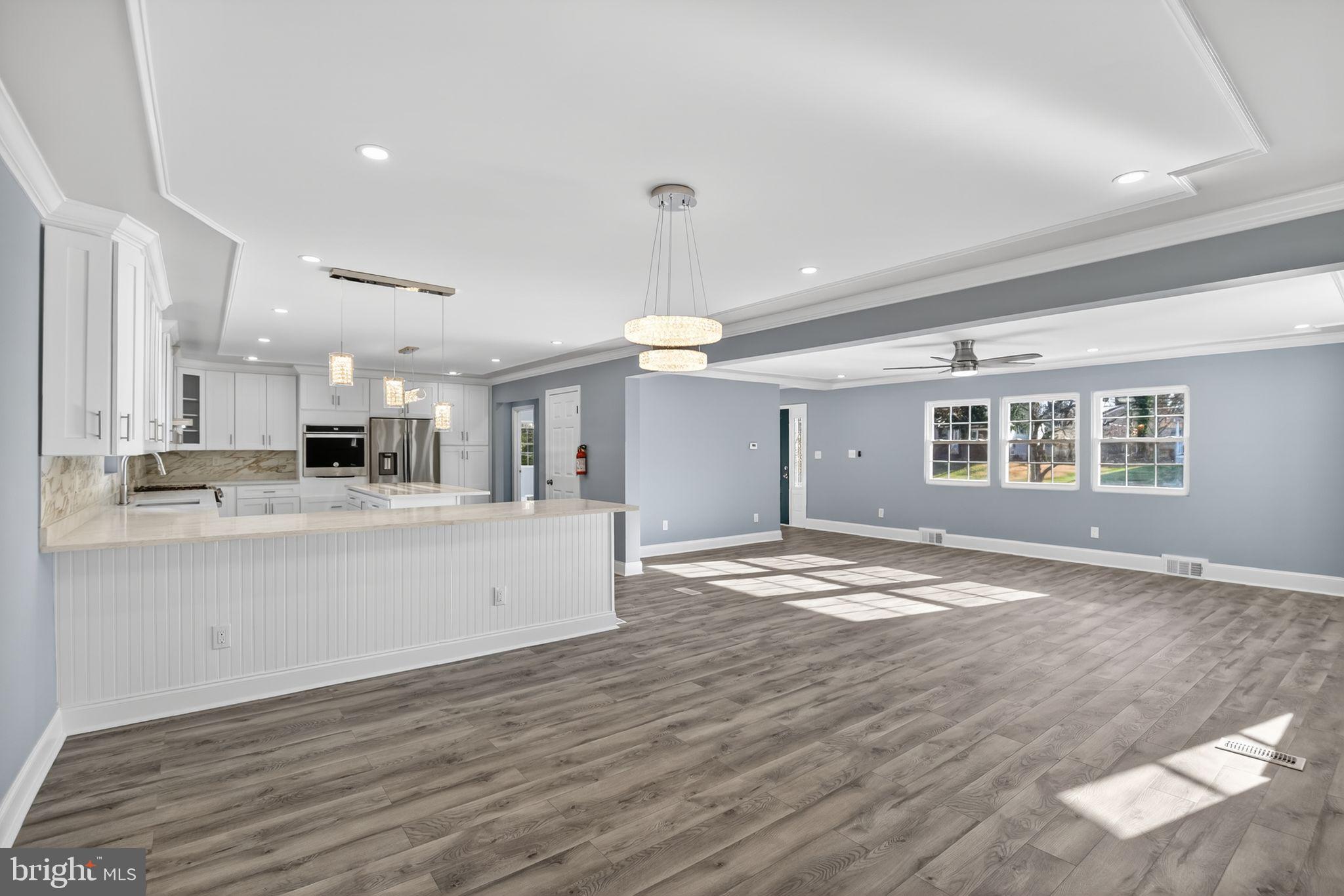 931 Woodlane Road Westampton, NJ 08060 - Photo 9 of 33 a view of an empty room with kitchen and window